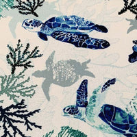 Blue sea turtle and turquoise reef print white upholstery curtain fabric.