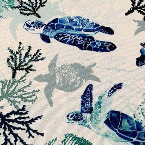 Blue sea turtle and turquoise reef print white upholstery curtain fabric.